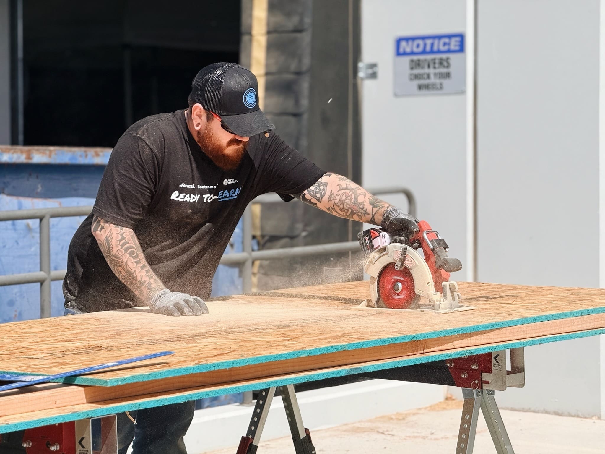 Contractor cutting remodeling materials for a Rapid Remodel kitchen renovation project