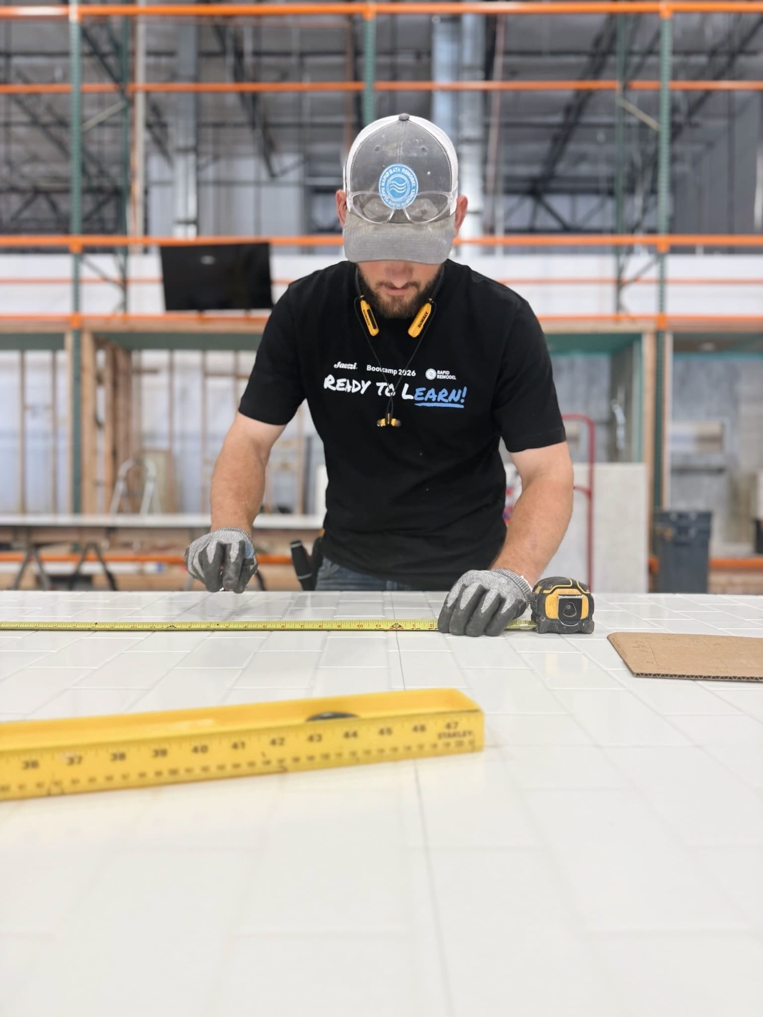 Rapid Remodel contractor measuring bathroom tile for a shower remodeling project