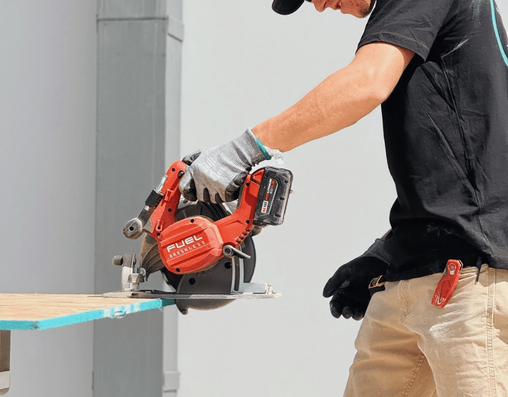 Contractor cutting materials for a kitchen remodeling project by Rapid Remodel