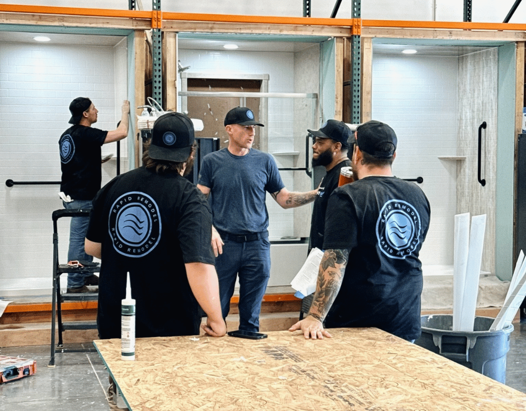 Rapid Remodel team reviewing kitchen remodeling materials during a renovation project