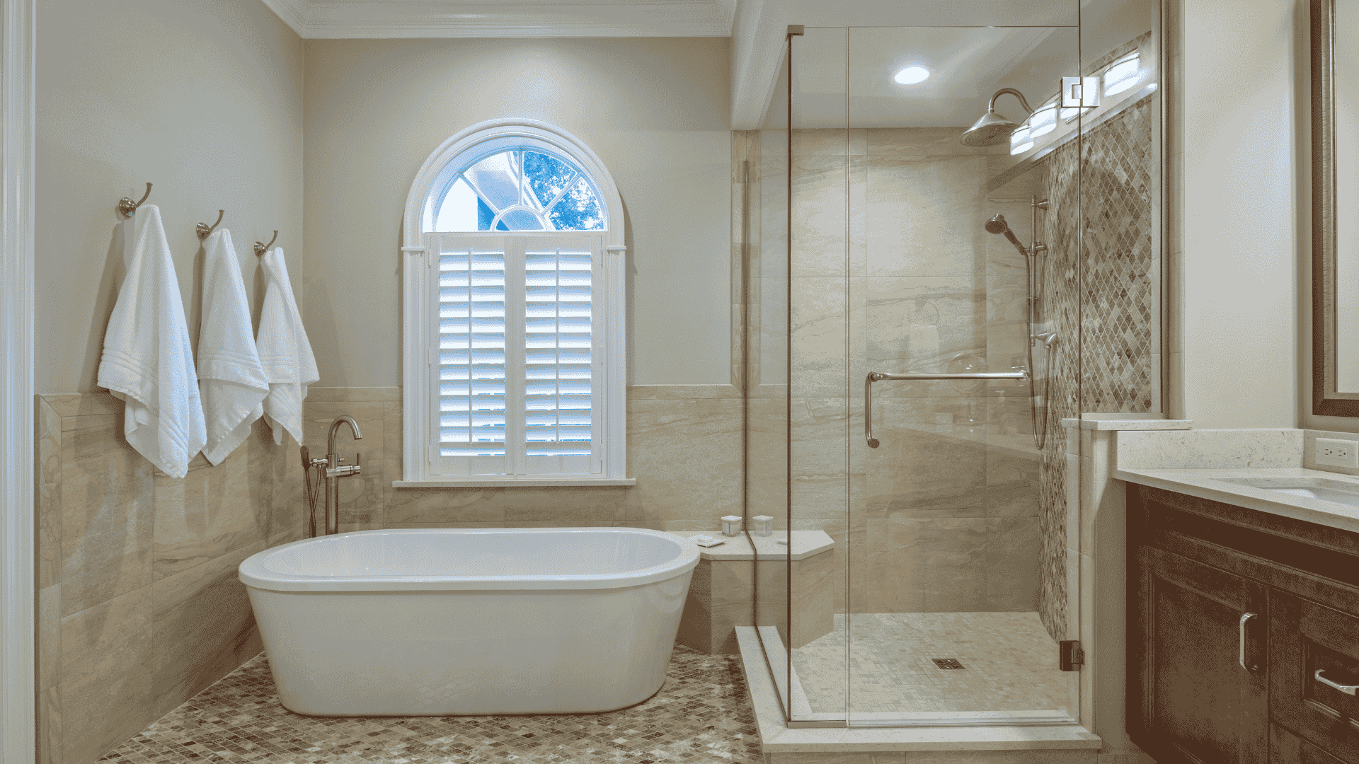 Newly remodeled shower with clean wall panels, grab bars, and modern fixtures