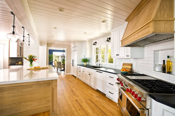 Experienced remodeler reviewing kitchen layout and finish durability for coastal conditions