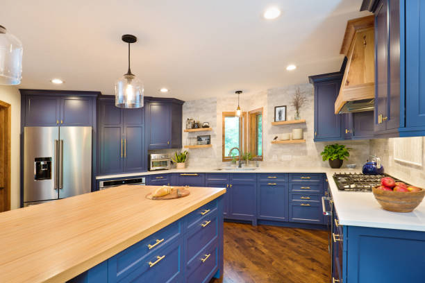 Kitchen Remodeling in Mission Viejo - CA in progress as a crew installs base cabinets and countertops