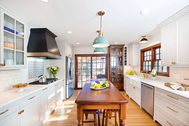 Experienced remodel specialist evaluating kitchen layout, finishes, and workflow for upscale performance